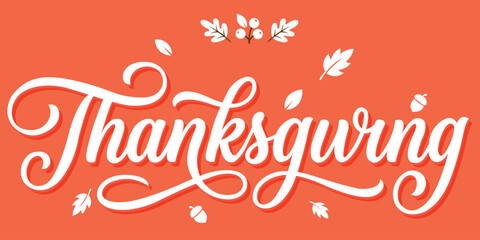 Decorative autumn script lettering with leaves and acorns on orange surface. © The Artist