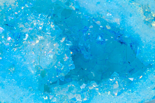 Blue crystal texture with mineral formations in macro view