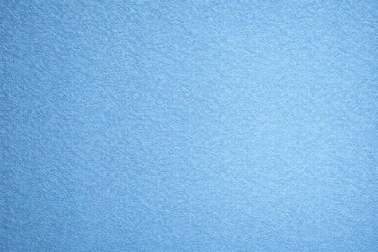 Blue paper texture with fine organic fibers and soft matte finish. Calm elegant surface ideal for stationery, packaging, book covers, backgrounds, and creative design projects