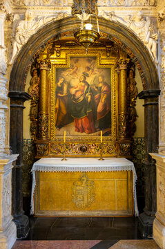 Ornate gilded altarpiece and chapel altar with religious painting inside the Cathedral of San Salvador, La Seo in Zaragoza, Spain.