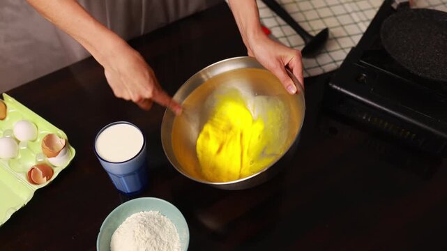 Making pancakes in the kitchen step by step with basic ingredients in a home setting for everyone to enjoy at breakfast time