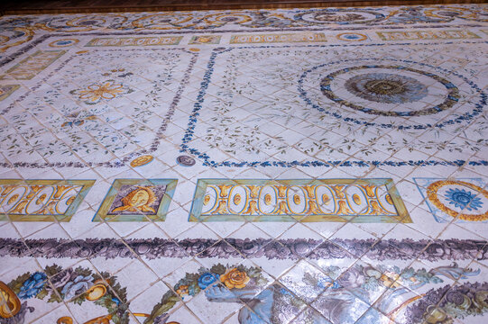 Angle view of the historic polychrome ceramic tile floor with ornate geometric patterns inside the sacristy of La Seo Cathedral in Zaragoza, 18th century baroque craftsmanship.