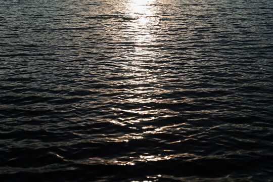 Golden Sunset Over Calm Sea with Reflections on the Water Horizon and Peaceful Coastal Evening Sky