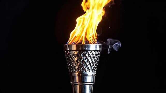 A bright metal torch burning with a vibrant orange flame