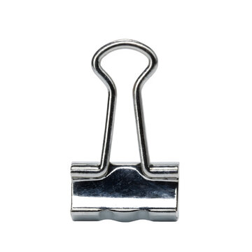 A single metallic binder clip for paper organization on a black background