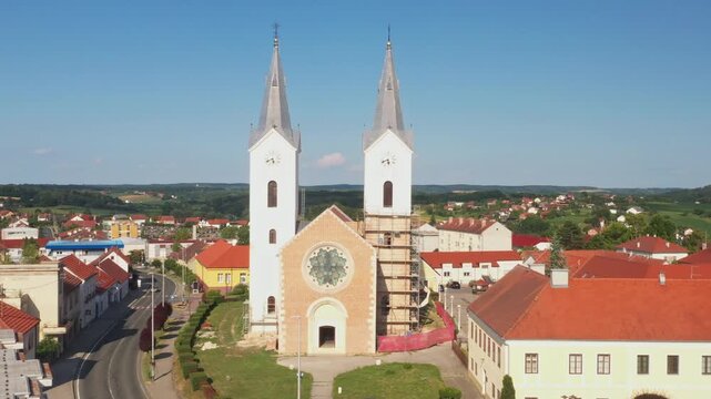 Aerial view of tower bells and church of St. Mary Magdalene in town of Cazma, Moslavina, Croatia