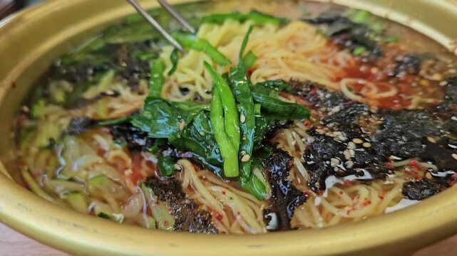 A video showing noodles, a representative commoner&rsquo;s food in Korea, served in a bowl