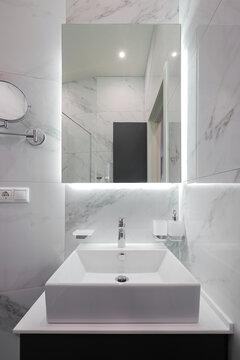 White bathroom sink with mirror