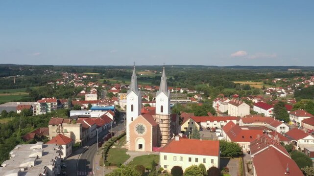 Aerial view of tower bells and church of St. Mary Magdalene in town of Cazma, Moslavina, Croatia