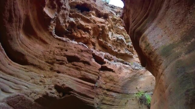 Vertical panning shot of the canyon Barranco de las Vacas in Gran Canaria with its breathtaking rock formations.