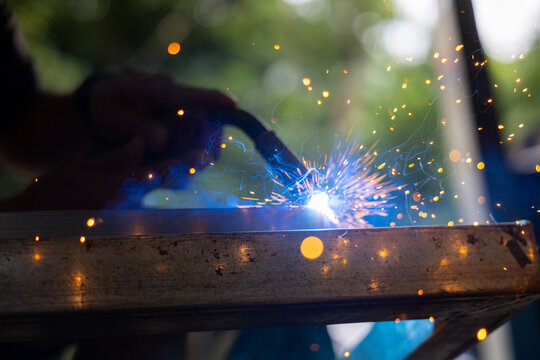 Welding spark metalworking welder torch steel workshop sparks blue light fabrication