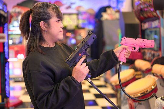 Cool Woman Dual Wielding Light Guns in Arcade Shooter