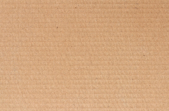 Cardboard sheet texture background, detail of recycle brown paper box pattern.