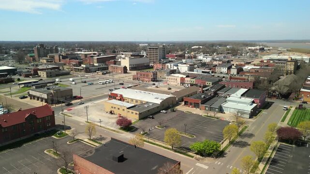 Rows of historic brick buildings make up a small town downtown skyline