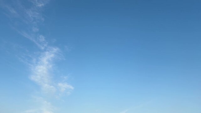 Minimal Blue Sky with Wispy Clouds and Spacious Copy Space