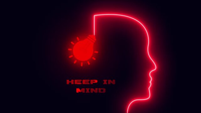 Keep in mind focused awareness concept featuring glowing red neon head outline with illuminated light bulb