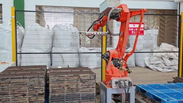 Industrial robotic arm handling rice cultivation substrate operation scenario