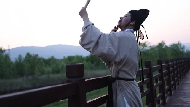An ancient Chinese poet reads and reflects alone by the lakeside at dusk