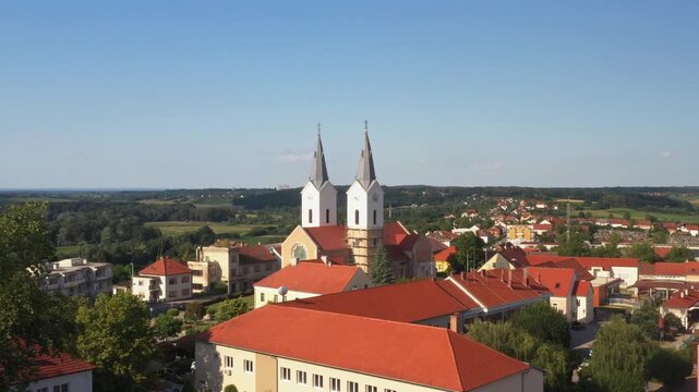Aerial view of tower bells and church of St. Mary Magdalene in town of Cazma, Moslavina, Croatia