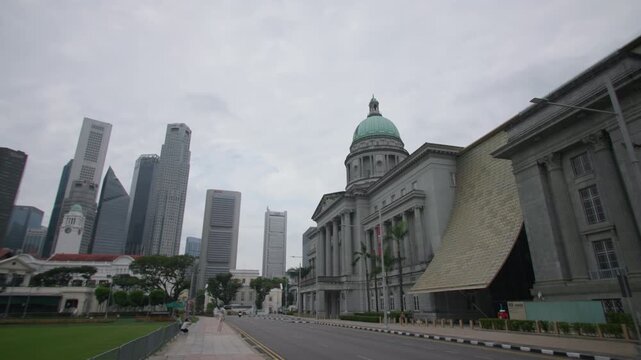 Historic National Gallery Singapore with grand colonial architecture surrounded by modern cityscape creating an iconic cultural destination for travel and tourism in Asia
