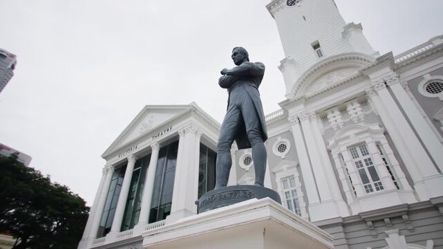 Victoria Concert Hall and Sir Stamford Raffles Monument in Singapore city showcasing elegant colonial architecture and historic urban landscape for tourism in Asia
