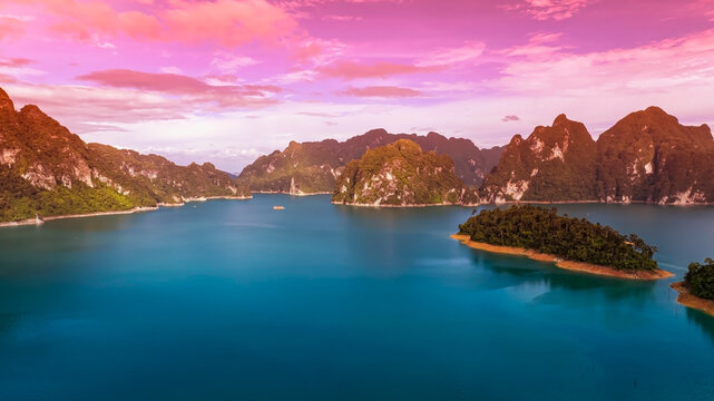 The green area at Khao Sok national park Cheow Lan Dam lake with blue sky background in Surat Thani, Thailand