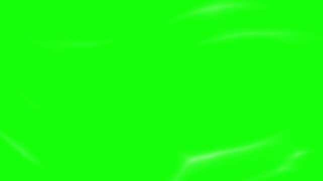 Fabric texture displays a vivid green surface with soft, flowing folds and gentle waves throughout the material.