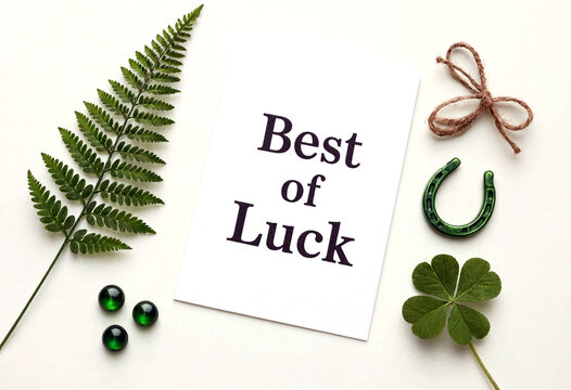Good luck greeting card with fern shamrock beads and horseshoe for st patrick celebration