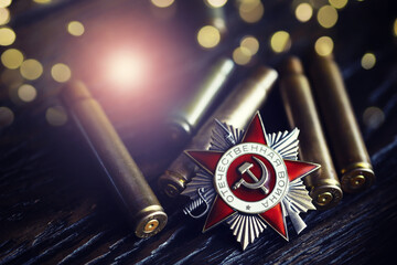 Fototapeta premium The Soviet order of the Second World war, Victory Day 9 May postcard concept, toned vintage
