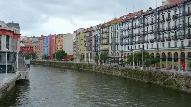 Colorful buildings along the nervion river in bilbao