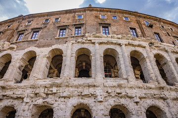 Obraz premium Theatre of Marcellus arches and ancient architecture in Rome, Italy