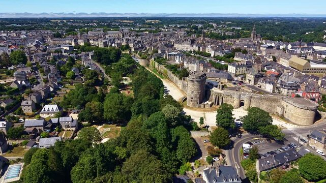 Ch&acirc;teau de Dinan, Porte du Guichet and the medieval fortified center of Dinan, C&ocirc;tes-d'Armor, Brittany, France, with Saint-Malo Basilica and the Rance Valley beyond, drone oblique pullback.