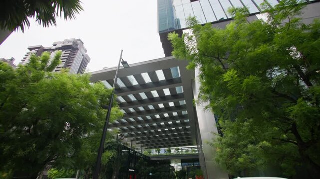 Green skyscrapers with lush trees in Singapore showcasing innovative eco architecture and a sustainable urban landscape for tourism across Asia