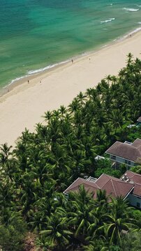 Vertical High Angle Aerial of Hidden Beach Villas and Turquoise Sea in Da Nang Landscape