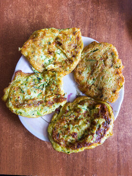 Freshly Cooked Homemade Vegetable Fritters Served on a White Plate