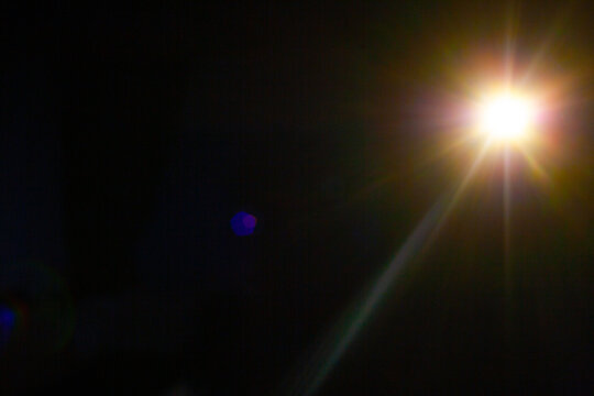 Sun flare on the black background