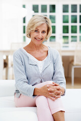 Smile, peace and portrait of old woman on sofa in home for weekend break, pride and wellness. Confidence, retirement and happy with senior person in living room in apartment for satisfaction and calm