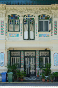 Facade of a conserved pre-war terrace house designed in Chinese Baroque style with neo-classical and Peranakan features, Petain Road, Singapore