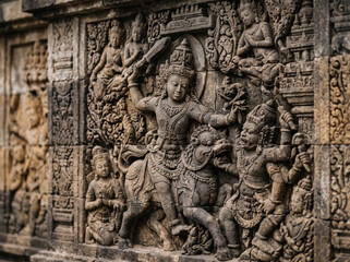 Obraz premium Ancient Stone Relief Sculpture On Tropical Temple Wall