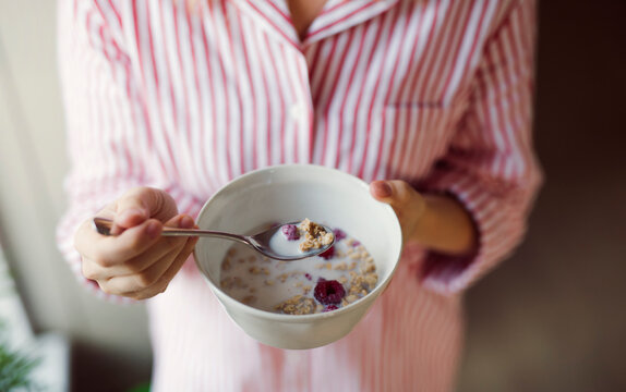 Close-up of woman holding cereal bowl