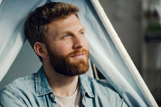Portrait of a man with beard, smiling