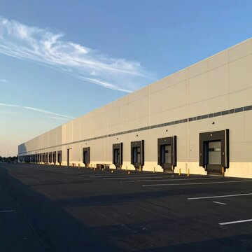 Vast white warehouse with many loading docks
