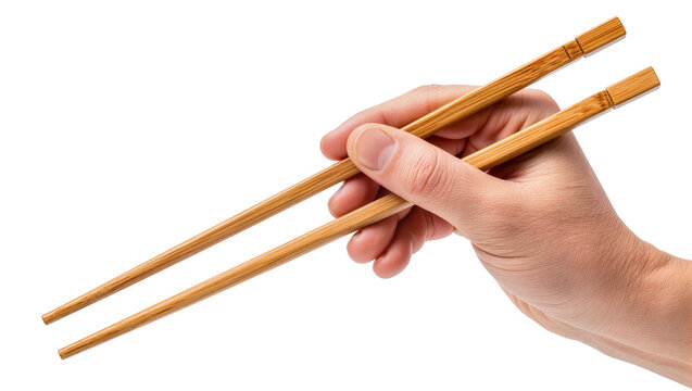 Human hand holding wooden chopsticks, isolated on transparent background