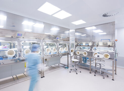 Scientists processing human tissue in insulator laboratory