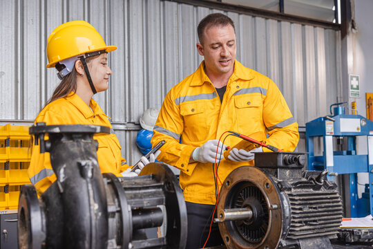 Engineer Checking DC Motor, Technician Man in Garage check inspecting service maintenance Stator.