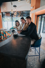 Three colleagues review papers and discuss plans while seated at a cafe counter. The team collaborates on remote work in a casual coworking setting.
