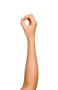 Woman s fingers forming a circular grip in mid-air. Left arm raised holding an invisible round