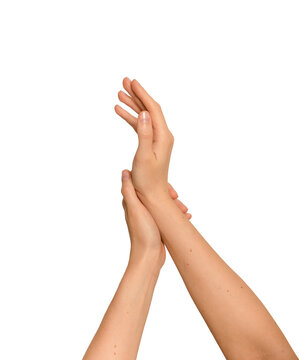 Woman s hands crossing gently in a beauty skincare gesture. Delicate arms touching during a