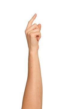 Woman s index finger extended in a tapping gesture. Right arm raised showing a soft pressing motion.