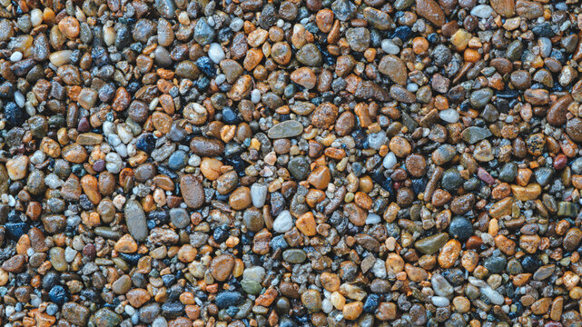 Abstract brown blue pebbles background with black snones wall grain grunge  texture for web banner template or wallpaper design